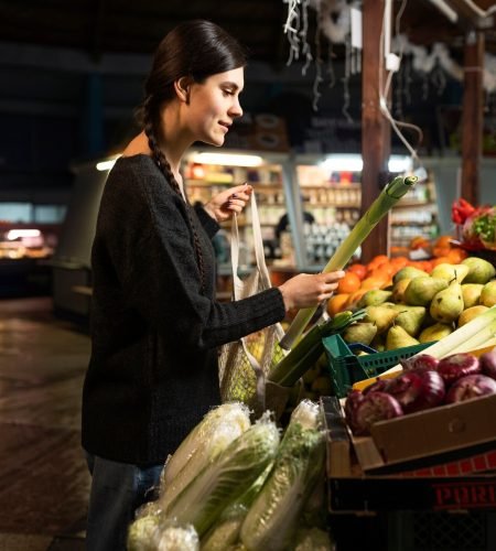 medium-shot-woman-buying-vegetables_23-2149295015