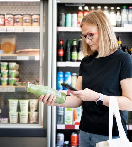 medium-shot-woman-holding-smartphone_23-2149148465